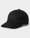 Black cotton baseball cap, front three-quarter view
Black unstructured cap, side profile with leather strap
Black cap rear view with brushed-silver adjustable clasp
Black-on-black embroidered oval logo on cap front